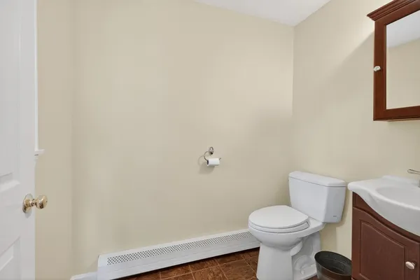 a bathroom with a toilet and a sink