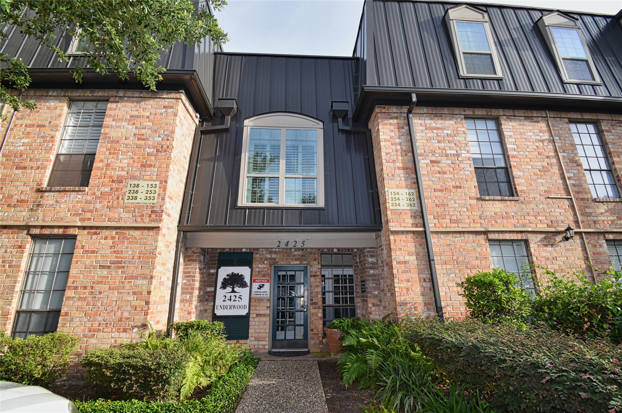 2425 Underwood Street, Unit 346 Houston, TX 77030 - Photo 1 of 30 a front view of a house with garden