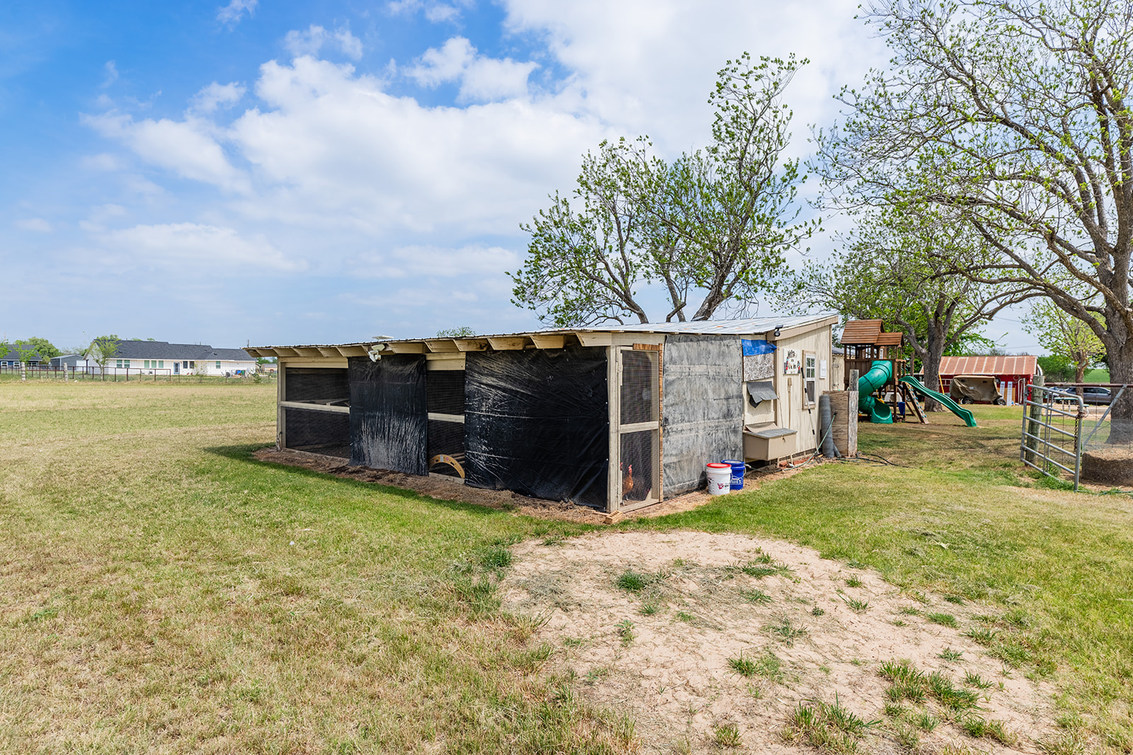 1001 Gravel Pit Road Taylor, TX 76574 - Photo 26 of 38 View of chicken coop featuring a lawn