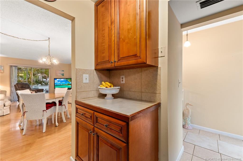 1980 Southwest Palm City Road, Unit 50J Stuart, FL 34994 - Photo 8 of 37 a kitchen with stainless steel appliances granite countertop a sink and a cabinets