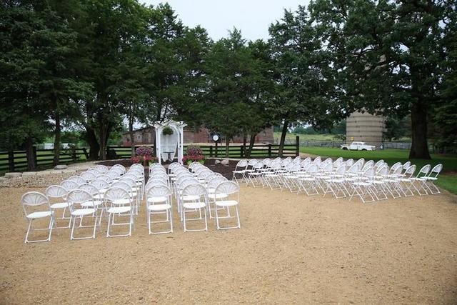 3261 South Daysville Road Oregon, IL 61061 - Photo 9 of 72 a view of a patio with table and chairs with wooden fence and large trees