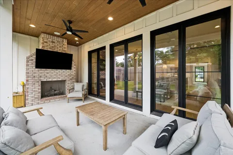 a kitchen with stainless steel appliances granite countertop a stove and a wooden floors