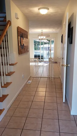 a view of a room with wooden floor