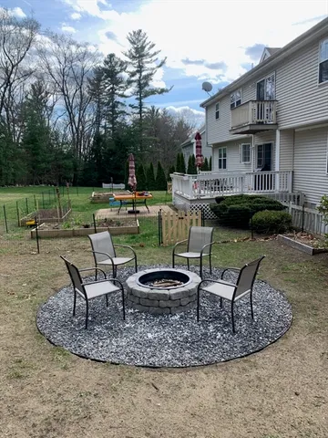 a view of a house with backyard porch and sitting area