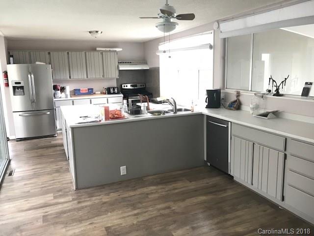 291 Potter Road Lancaster, SC 29720 - Photo 16 of 31 a kitchen with kitchen island a sink stainless steel appliances and cabinets