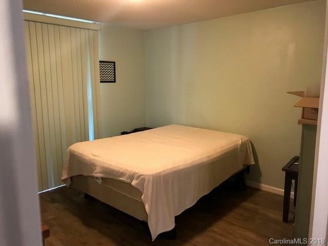 291 Potter Road Lancaster, SC 29720 - Photo 21 of 31 a bed sitting in a bedroom next to a small yard