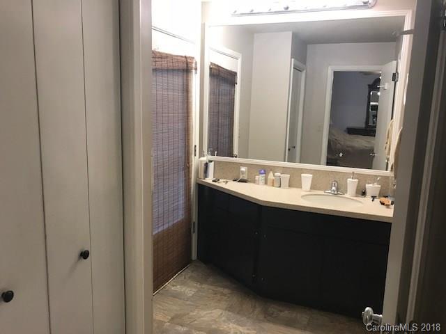 291 Potter Road Lancaster, SC 29720 - Photo 22 of 31 a bathroom with a double vanity sink and mirror
