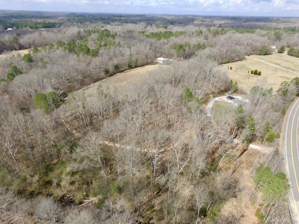 291 Potter Road Lancaster, SC 29720 - Photo 9 of 31 a view of a dry field with trees in the background