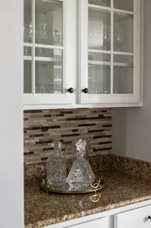 a kitchen with a sink a stove a refrigerator and cabinets