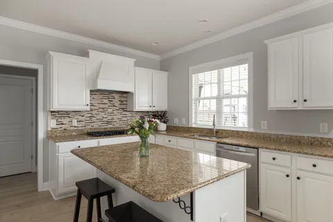 a view of store room with food items with white countertops