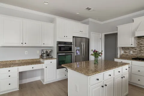a living room with a fireplace and a flat screen tv