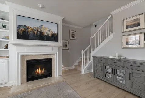 a view of an empty room with a window and balcony