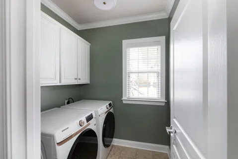 a view of walk in closet with clothes