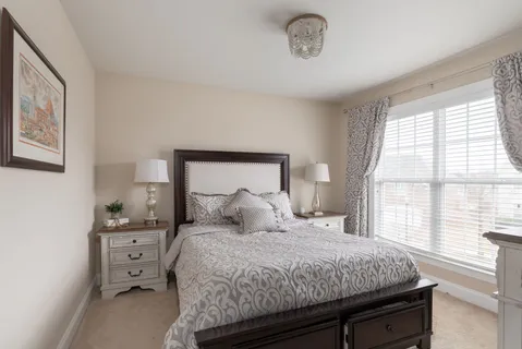 a spacious bathroom with a granite countertop sink a mirror and a