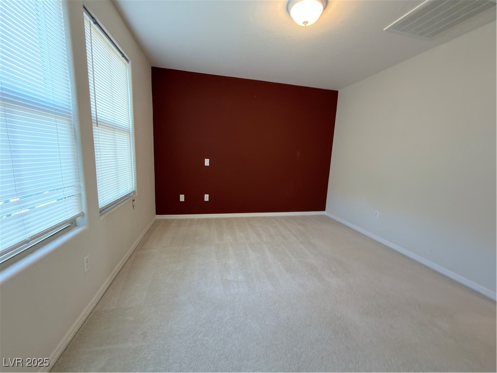 4650 Ranch House Road, Unit 95 North Las Vegas, NV 89031 - Photo 17 of 50 Empty room with light colored carpet and baseboards