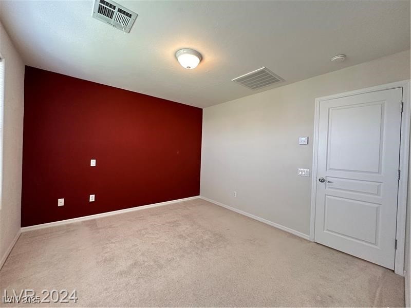 4650 Ranch House Road, Unit 95 North Las Vegas, NV 89031 - Photo 33 of 50 Spare room with light colored carpet and baseboards