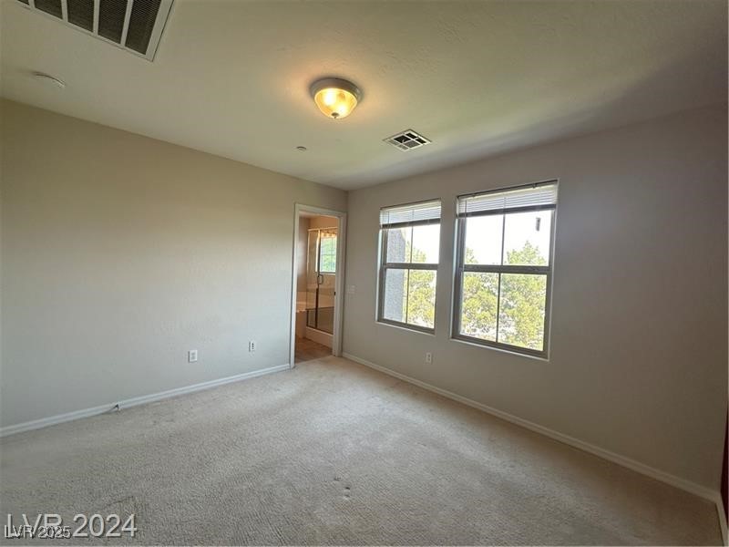 4650 Ranch House Road, Unit 95 North Las Vegas, NV 89031 - Photo 35 of 50 Unfurnished bedroom featuring carpet floors and baseboards