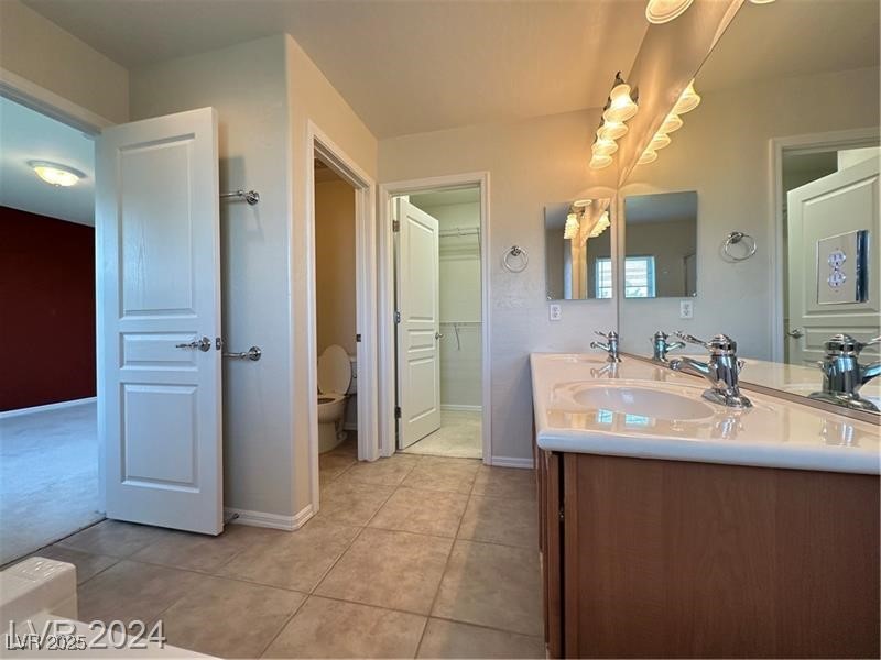 4650 Ranch House Road, Unit 95 North Las Vegas, NV 89031 - Photo 36 of 50 Full bathroom with double vanity and light tile patterned floors