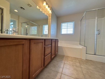4650 Ranch House Road, Unit 95 North Las Vegas, NV 89031 - Photo 37 of 50 Bathroom with a stall shower, double vanity, a bath, and light tile patterned floors