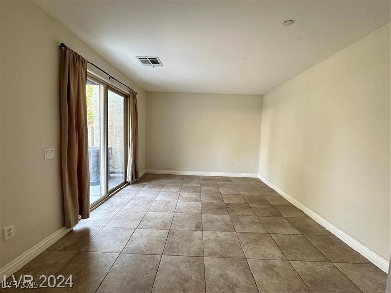 4650 Ranch House Road, Unit 95 North Las Vegas, NV 89031 - Photo 45 of 50 Tiled spare room featuring baseboards