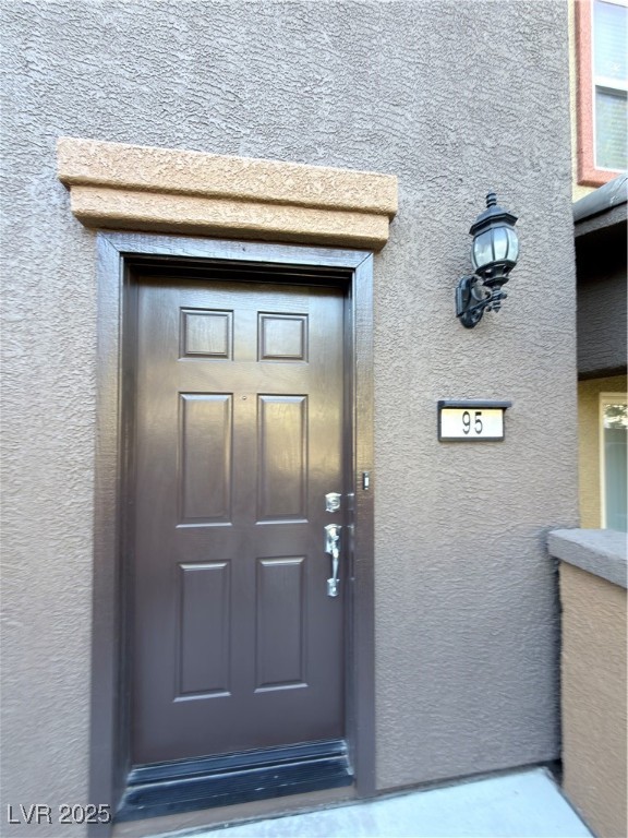 4650 Ranch House Road, Unit 95 North Las Vegas, NV 89031 - Photo 8 of 50 Property entrance with stucco siding