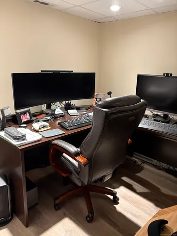 a living room with lots of furniture and clutter