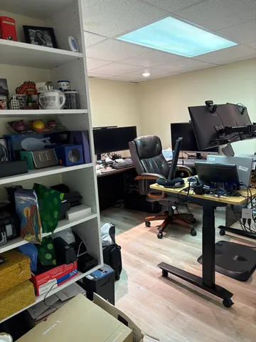 a view of a workspace with furniture