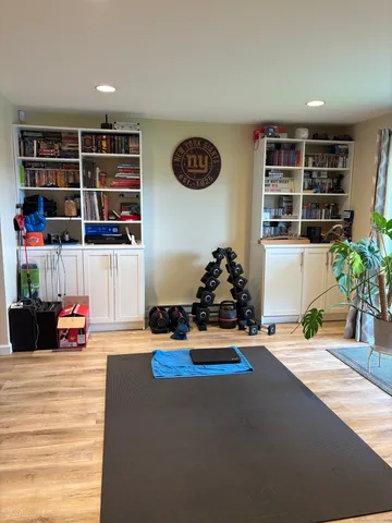 a room with gym equipment and a mirror