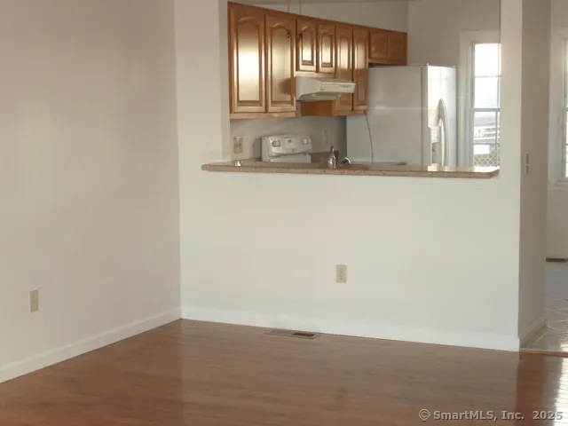 a view of a hallway with granite countertop