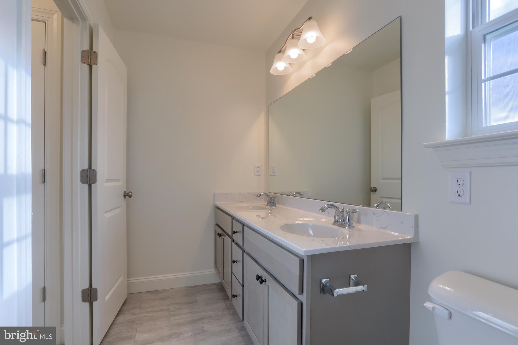 0 Lavender Lane Lebanon, PA 17042 - Photo 17 of 23 a bathroom with a sink vanity and a mirror