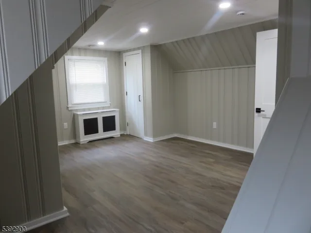 a kitchen with stainless steel appliances granite countertop a refrigerator a stove a sink and a microwave