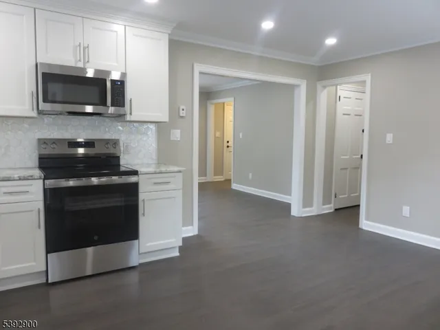 a kitchen with a stove and a microwave