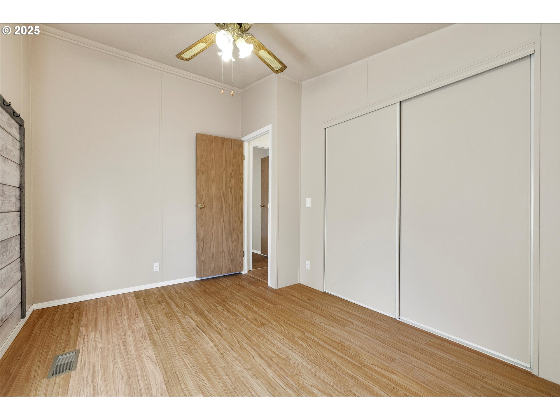 507 North 19th Avenue, Unit 60 Cornelius, OR 97113 - Photo 19 of 28 a view of an empty room with wooden floor