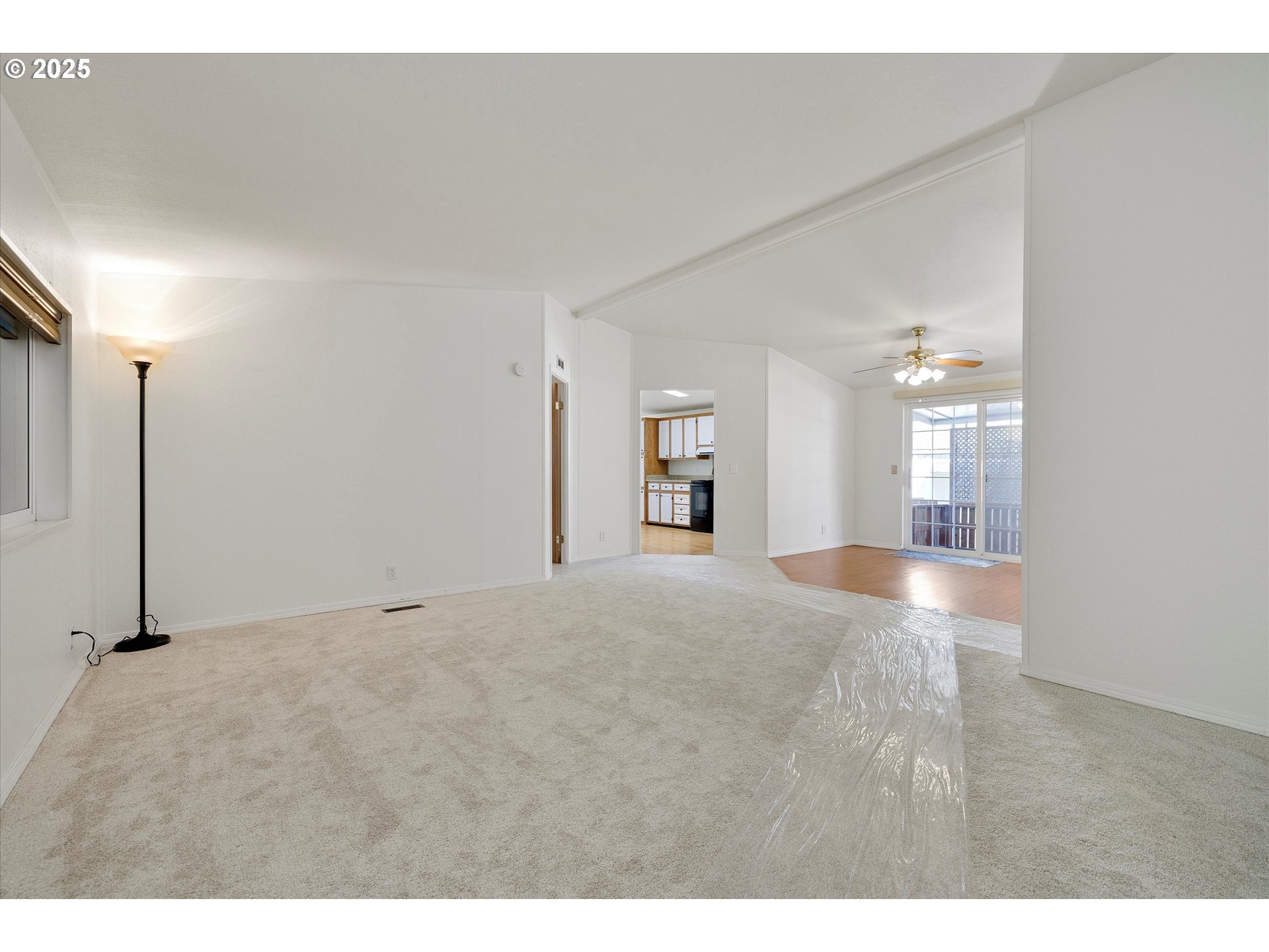 507 North 19th Avenue, Unit 60 Cornelius, OR 97113 - Photo 6 of 28 a view of an empty room with kitchen and a window