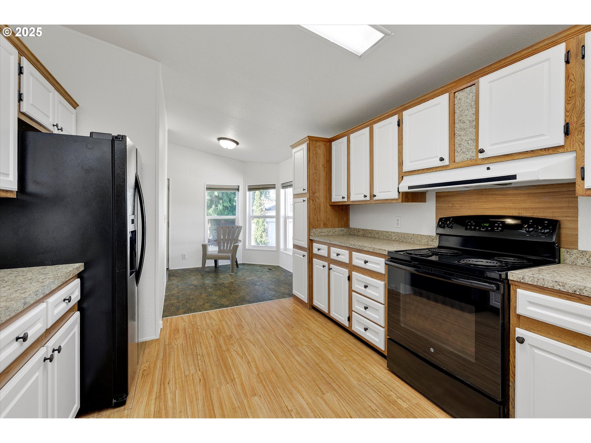 507 North 19th Avenue, Unit 60 Cornelius, OR 97113 - Photo 10 of 28 a kitchen with granite countertop a refrigerator stove top oven and sink