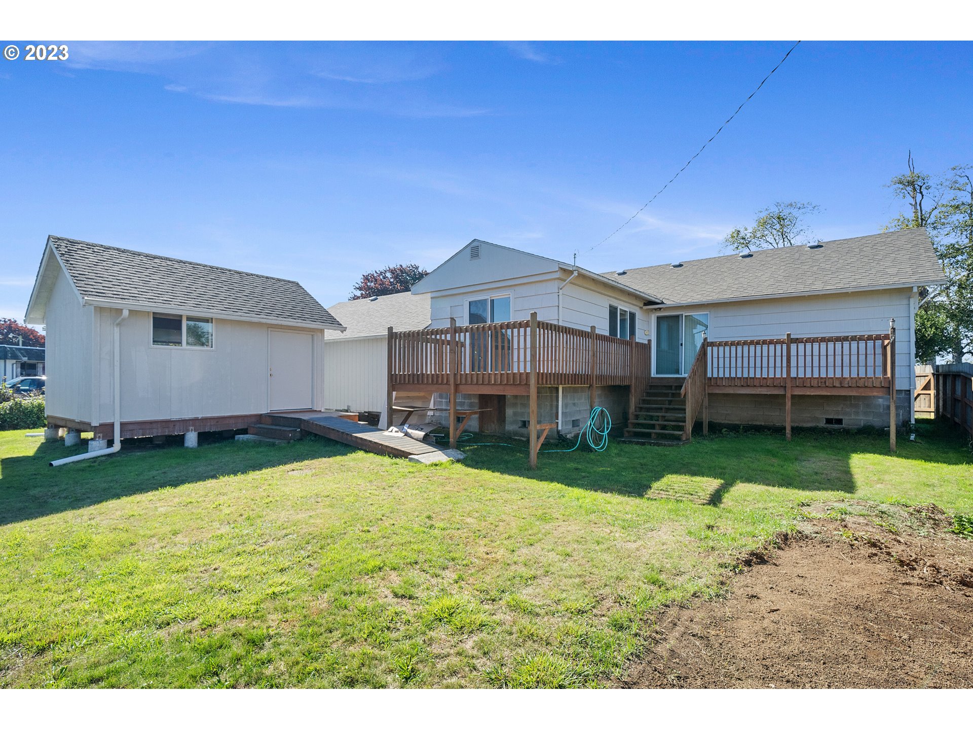 2450 Nielsen Road Tillamook, OR 97141 - Photo 5 of 22 a view of a house with a backyard