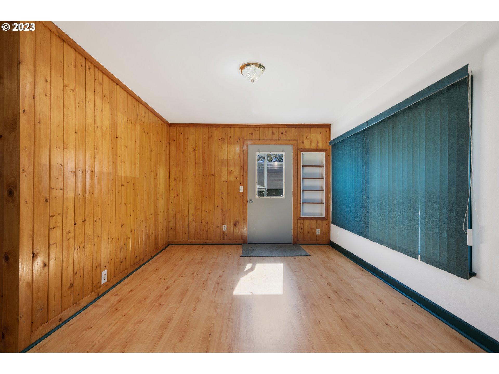 2450 Nielsen Road Tillamook, OR 97141 - Photo 7 of 22 a view of an empty room with wooden floor