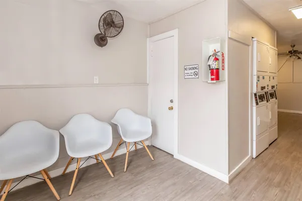 a view of kitchen with furniture and wooden floor