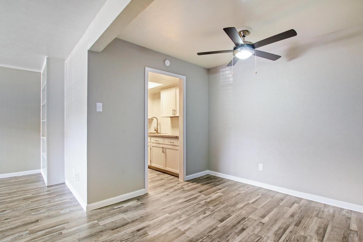 1212 Hampshire Lane, Unit 1322 Richardson, TX 75080 - Photo 6 of 50 a view of empty room with wooden floor and fan