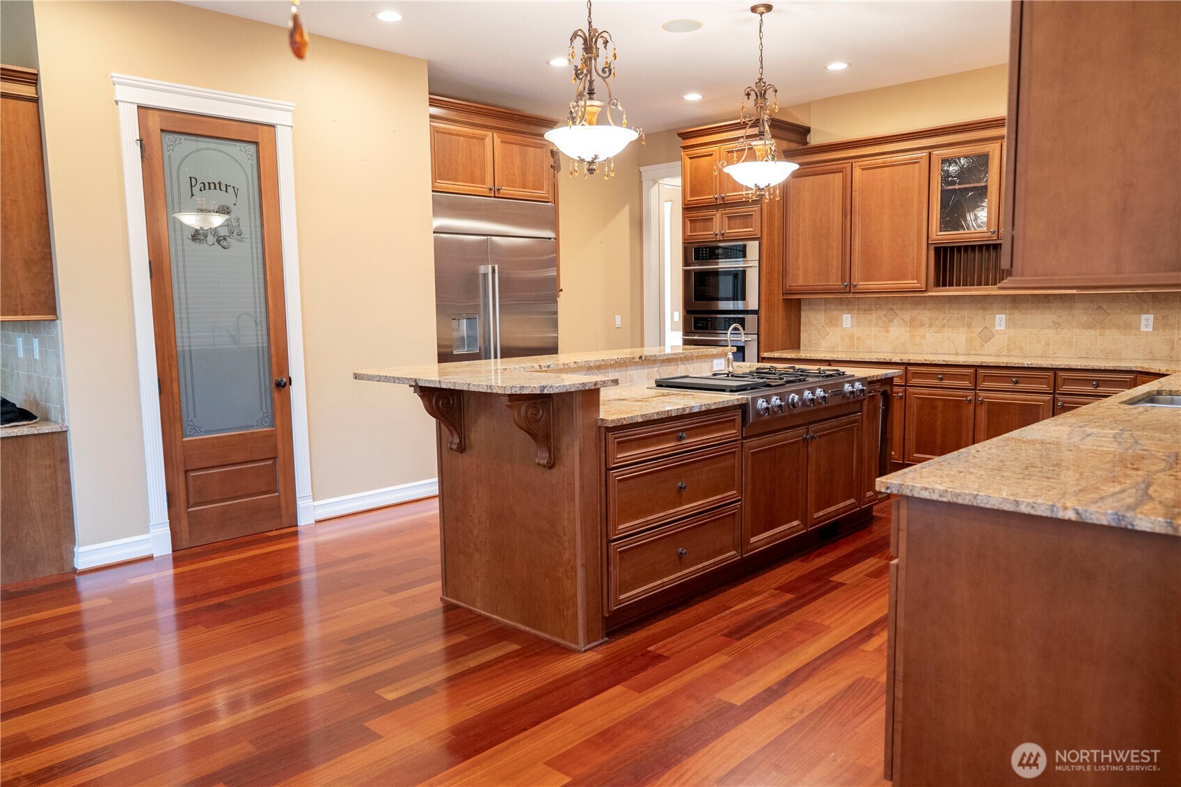 9701 148th Street Southeast Snohomish, WA 98296 - Photo 4 of 18 a kitchen with stainless steel appliances granite countertop a stove a sink and a refrigerator