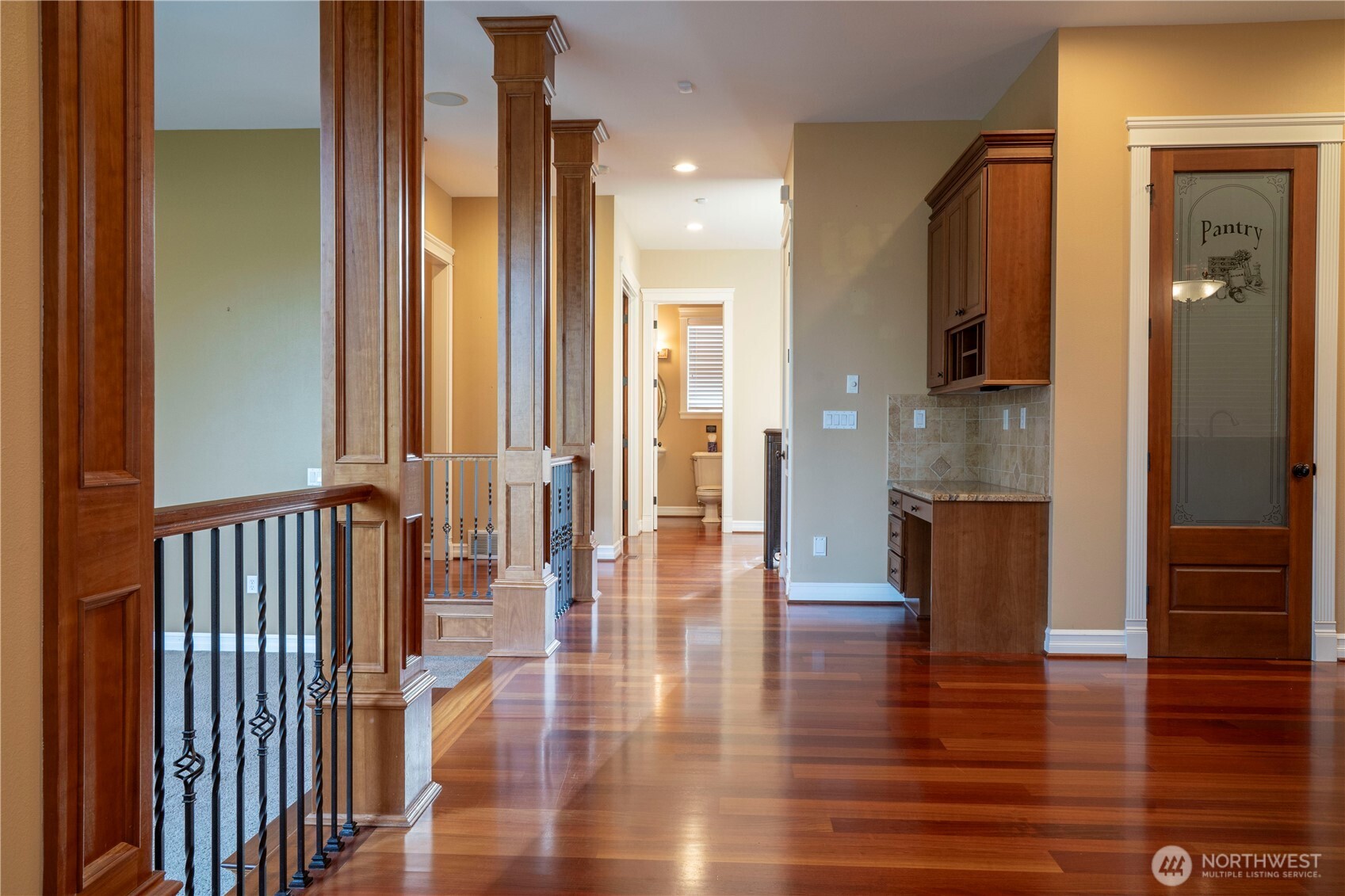 9701 148th Street Southeast Snohomish, WA 98296 - Photo 7 of 18 a view of a hallway with wooden floor and staircase