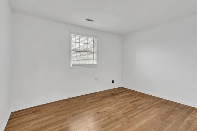 a view of kitchen with refrigerator stove microwave and cabinets