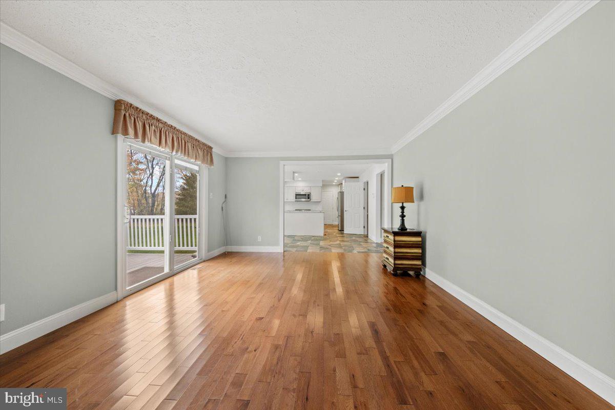 304 Hialeah Drive Mount Laurel, NJ 08054 - Photo 14 of 57 a view of empty room with wooden floor and fan
