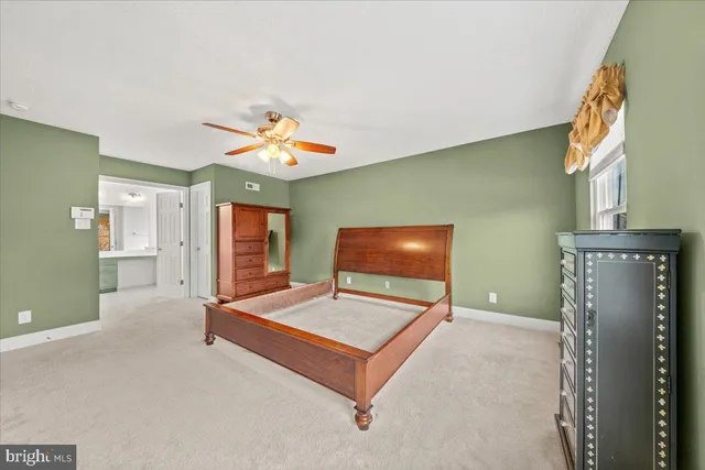 a bathroom with a tub a sink and mirror