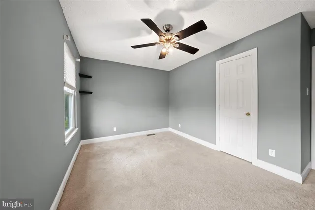 a kitchen with stainless steel appliances granite countertop a sink a stove and a wooden floors