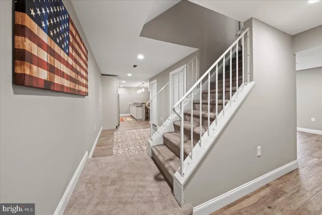 a room with furniture and a kitchen view