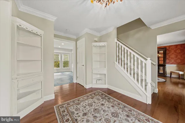 a view of entryway with wooden floor