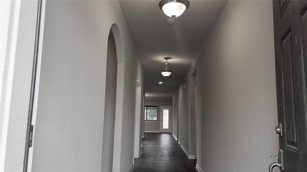 2101 Long Forest Road Forney, TX 75126 - Photo 3 of 15 a view of a hallway with wooden floor