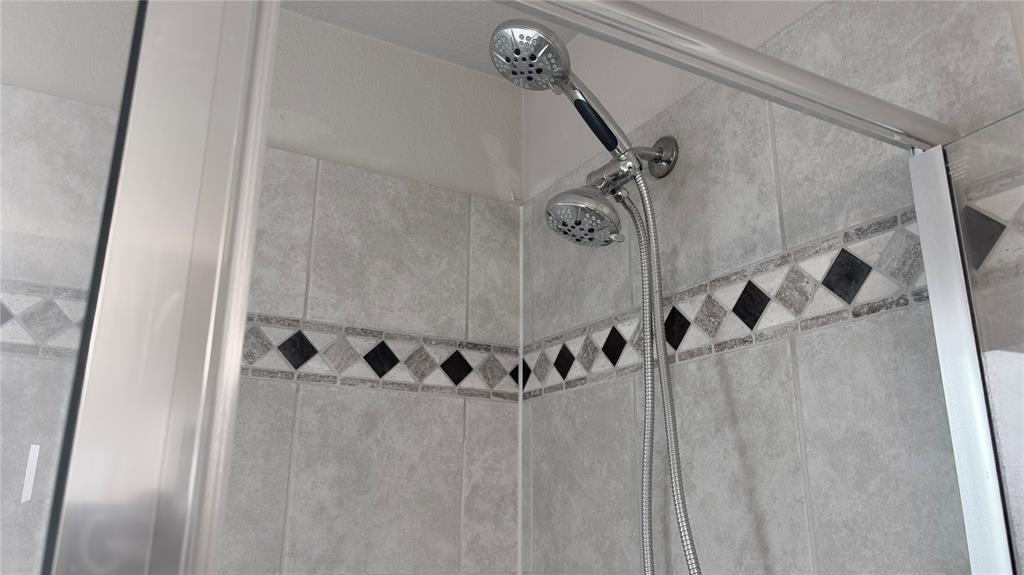 2101 Long Forest Road Forney, TX 75126 - Photo 8 of 15 a bathroom with a bathtub and shower