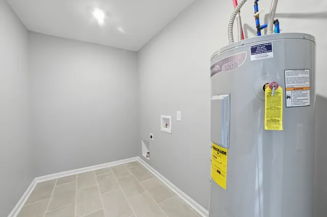 a view of a storage & utility room with a sink
